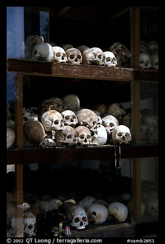 Skulls of executed prisoners, Choeng Ek Killing Fields memorial. Phnom Penh, Cambodia (color)