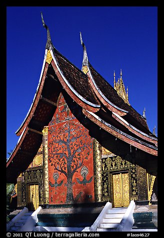 Rear of the Sim of Wat Xieng Thong with mosaic of the tree of life. Luang Prabang, Laos (color)