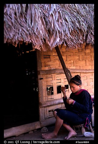 Woman of the Lao Huay tribe in front of her hut,  Ban Nam Sang village. Laos