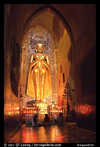 One of four monumental statues inside Ananda pahto. Bagan, Myanmar (color)