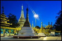 Shrines, stupas, and Main Stupa at dawn, Shwedagon Pagoda. Yangon, Myanmar