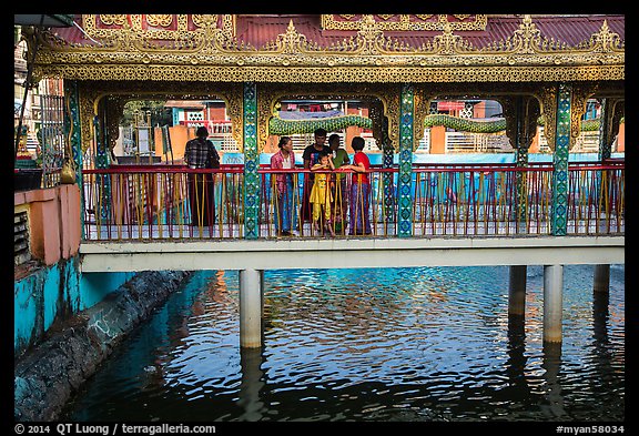Family at turtle pond, Botataung Pagoda. Yangon, Myanmar (color)