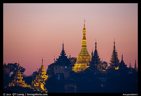 Distant view of Naungdawgyi Pagoda and shrines at dawn. Yangon, Myanmar (color)