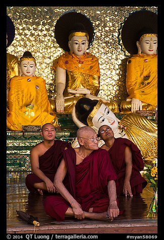 Monks and buddha statues, Shwedagon Pagoda. Yangon, Myanmar