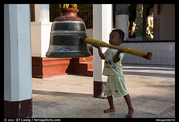 Child ringing bell, Shwedagon Pagoda. Yangon, Myanmar (color)