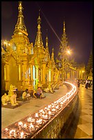 Oil lamps, stupas and shrines at night, Shwedagon Pagoda. Yangon, Myanmar