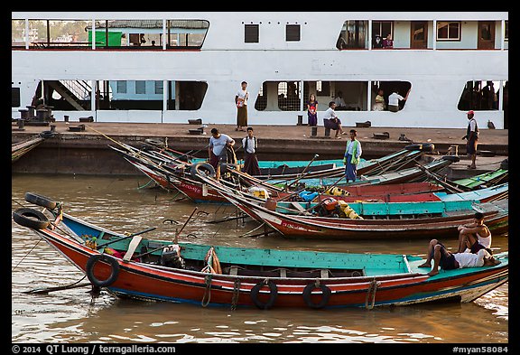 Long-tail boats and ferry, Sinodan pier. Yangon, Myanmar (color)