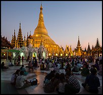 Praying from the Victory Ground, Shwedagon Pagoda, sunset. Yangon, Myanmar