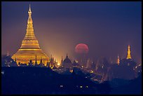 Moonset over Shwedagon Pagoda. Yangon, Myanmar