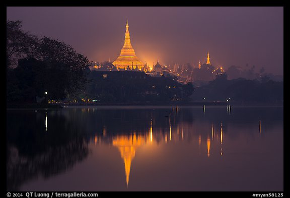 Shwedagon Pagoda reflected in Royal (Kandawgyi) Lake at twilight. Yangon, Myanmar