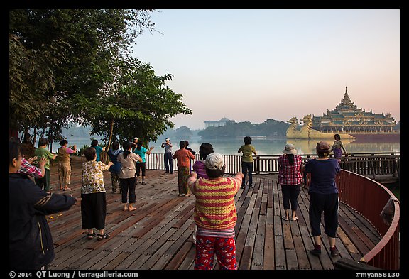 Group practising Tai Chi near Karawiek Hall at sunrise, Kandawgyi Lake Park. Yangon, Myanmar (color)