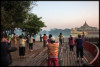 Group practising Tai Chi near Karawiek Hall at sunrise, Kandawgyi Lake Park. Yangon, Myanmar ( color)