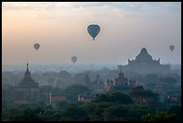 Aerial view of ancient temples and hot air ballons at sunrise. Bagan, Myanmar