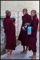 Three monks conversing at Mahagandayon Monastery. Amarapura, Myanmar ( color)
