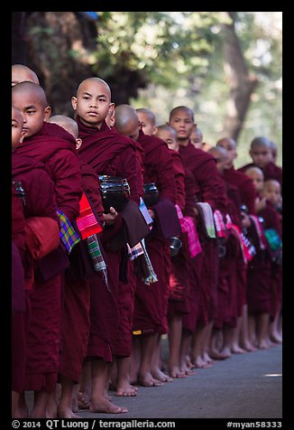 Monks lining up with alms bowls, Mahagandayon Monastery. Amarapura, Myanmar (color)