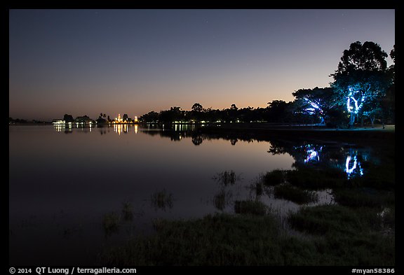 Pone Tanoke Lake at night with illuminated trees and pagoda. Pindaya, Myanmar (color)