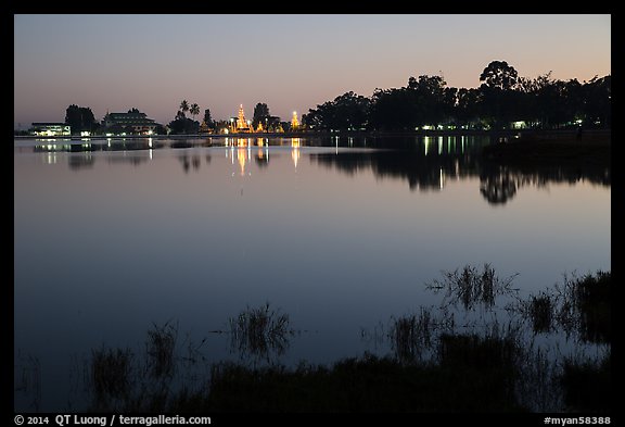 Illuminated pagoda reflected in Pone Tanoke Lake. Pindaya, Myanmar (color)