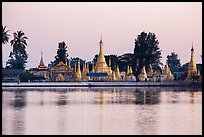 Pagoda reflected in Pone Tanoke Lake at dawn. Pindaya, Myanmar ( color)