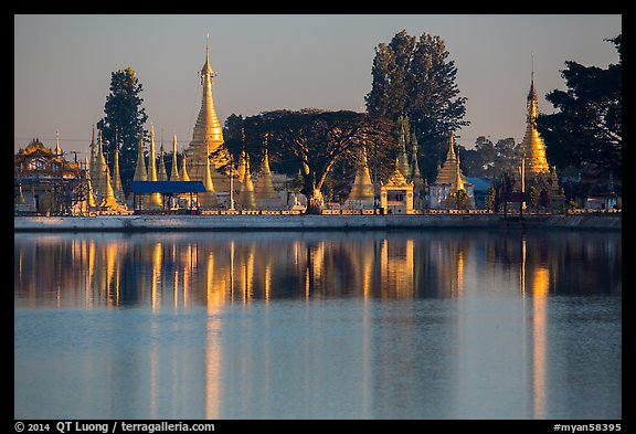 Pagoda reflected in Pone Tanoke Lake at sunrise. Pindaya, Myanmar (color)