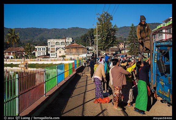 Women loading truck near market. Pindaya, Myanmar (color)