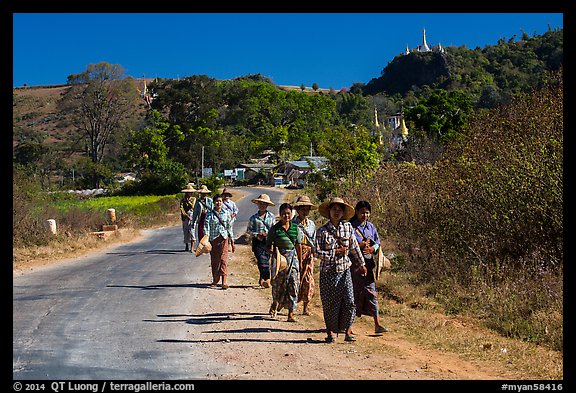 Women walking on road. Shan state, Myanmar (color)