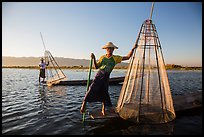Intha fishermen with conical baskets in warm afternoon light. Inle Lake, Myanmar ( color)