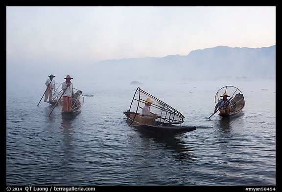 Group of Intha fishermen on misty waters. Inle Lake, Myanmar (color)