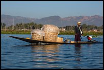 Man transporting baskets on boat. Inle Lake, Myanmar ( color)