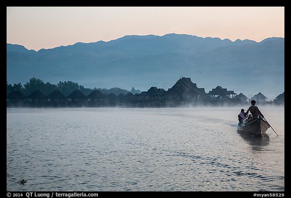 Boat leaving resort in dawn mist. Inle Lake, Myanmar (color)