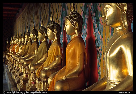 Row of Buddha figures, Wat Arun. Bangkok, Thailand (color)