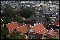 Temple roofs and modern buildings from above. Bangkok, Thailand (color)