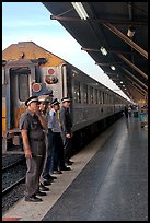 Attendants and train, Hualamphong station. Bangkok, Thailand