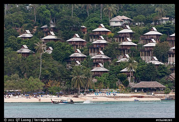 Beach and hillside bungalows on stilts, Ko Phi-Phi island. Krabi Province, Thailand (color)
