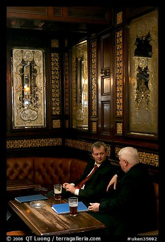 Business men talking over a beer, Victorian boozer Princess Louise. London, England, United Kingdom