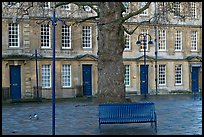 Blue metal bench and tree, Kingsmead Square. Bath, Somerset, England, United Kingdom