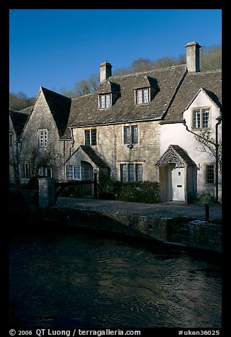 Cotswold type cottages and Bybrook River, Castle Combe. Wiltshire, England, United Kingdom (color)
