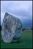 Standing stone and chapel at dusk, Avebury, Wiltshire. England, United Kingdom (color)