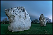 Large standing stones and brewing storm at dusk, Avebury, Wiltshire. England, United Kingdom