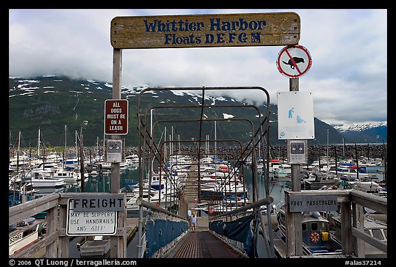Ramp to harbor deck with Whittier sign. Whittier, Alaska, USA