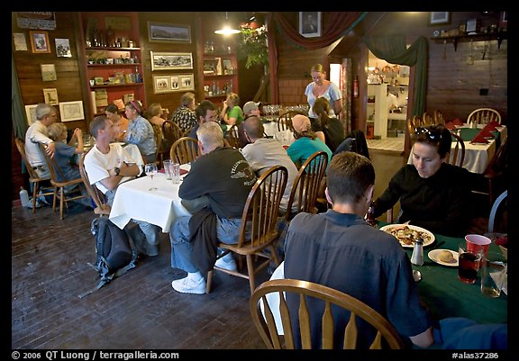 Dinner inside Mc Carthy lodge. McCarthy, Alaska, USA (color)