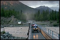 Four wheeler crossing the footbridge. McCarthy, Alaska, USA ( color)