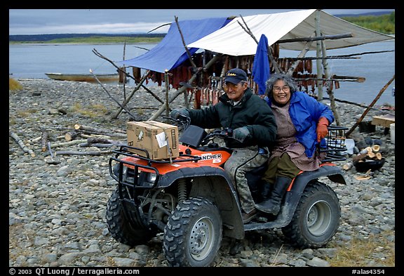 Inupiaq Eskimo man and woman riding on a four-wheeler, Ambler. North Western Alaska, USA