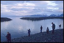 Fishing for salmon in the Spit's Fishing Hole. Homer, Alaska, USA ( color)