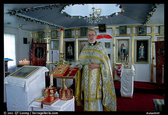 Orthodox priest inside the old Russian church. Ninilchik, Alaska, USA (color)