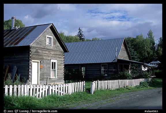White picket fence and wooden houses. Hope,  Alaska, USA (color)
