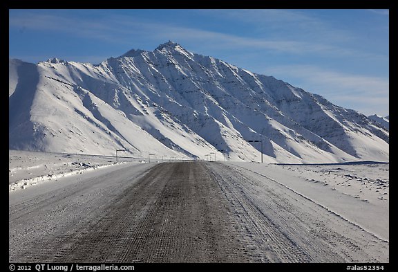 Frozen James Dalton Highway below Arctic Mountains. Alaska, USA (color)