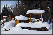 Machinery covered in snow. Wiseman, Alaska, USA