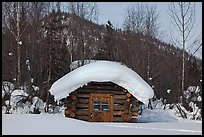 Snow-covered cabin. Wiseman, Alaska, USA