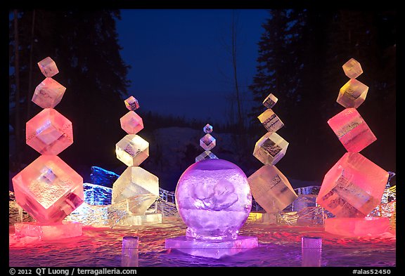 Balancing cubes made of ice at night, World Ice Art Championships. Fairbanks, Alaska, USA (color)