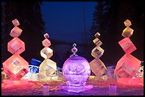 Balancing cubes made of ice at night, World Ice Art Championships. Fairbanks, Alaska, USA ( color)